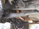 1984 Ford Bronco - Underside view of a vehicle's chassis and exhaust system, with a Supermotors.net watermark.