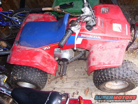 Red and blue Honda 70 Fourtrax ATV, side view