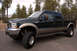 2003 Ford F-350 - This 2003 Ford F-250 Super Duty pickup truck is shown from the front-three-quarter view.