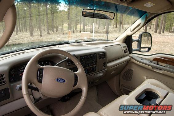 Interior of 2003 Ford F-350, showing dashboard, steering wheel, and center console