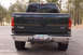 2003 Ford F-350 - Rear view of a dark green Ford F-250 Super Duty pickup truck, an Arizona license plate.
