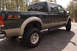 2003 Ford F-350 - This pickup truck features a two-tone paint scheme and FX4 Off Road badging on the rear fender.