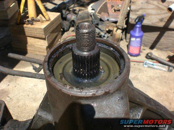 cimg0512.jpg Under the seal you will find the slinger ring. Hopefully it didnt get damaged from the seal removal. If you remove the ring with a magnet you can lift the outer bearing to inspect. Be sure to install the slinger before the new seal. Dont want to trash the new seal because you forgot it on the bench.