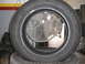 1994 Ford Probe - A tire and a fan are the subjects of this image, with no vehicle visible.