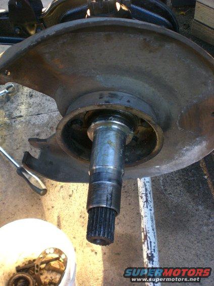cimg0517.jpg Chevy 1/2ton backing place. Conversion spindle. Not just a small bearing spindle. 
Those will work kind of. You will run out of thread for the second lock nut. This spindle has been turned down so you have enough thread for the lock nuts. 

There are 3 styles of caliper brackets that I know of. The full circle heavy brackets. The brackets with thin tin dust shields. and the brackets with no dust shields. All work the same.