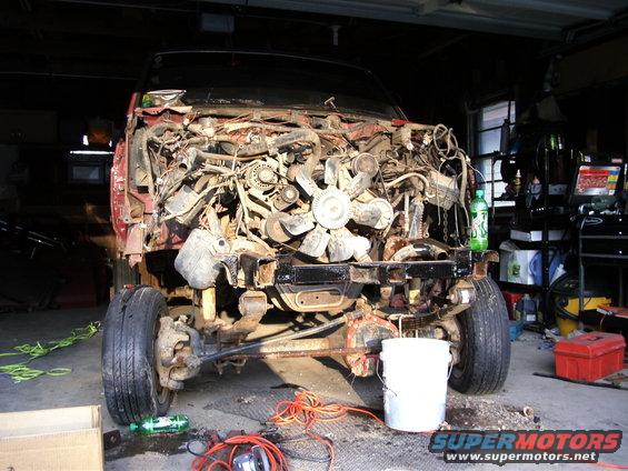 1994 Ford F-250 engine bay disassembled, showing engine and front suspension components