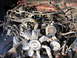 1994 Ford F-250 - Close-up view of a disheveled engine bay, showing numerous hoses and electrical wires.