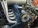 1970 Sand Rail High Jumper - Close-up view of a custom engine with shiny chrome headers and exposed wiring.