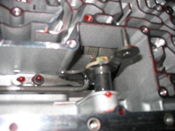 Transmission valve body with red fluid residue