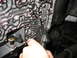 1995 Ford C-350 (Centurion Conversions) - Cleaning the intricate passages of a transmission valve body with a specialized tool.
