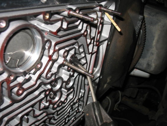 Transmission valve body with bolts and red fluid