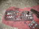 1995 Ford C-350 (Centurion Conversions) - A disassembled transmission valve body, showing the intricate channels filled with red fluid, rests on a red cloth.