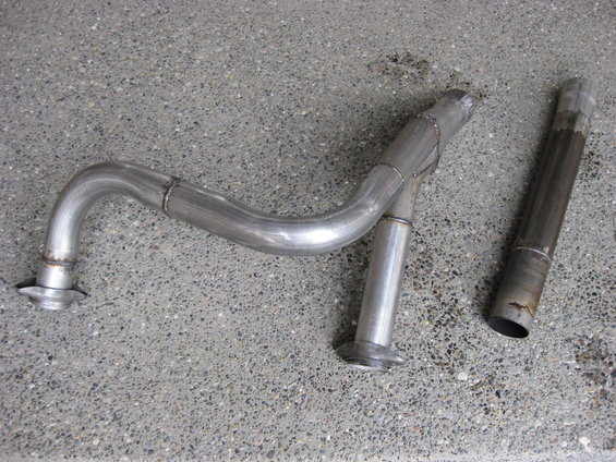 Custom exhaust pipe assembly and a separate flex pipe section on concrete