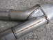 1979 Ford Bronco - Custom exhaust pipes show signs of wear and tear, with visible rust and rough welding.