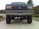 1990 Ford Bronco - This lifted Ford truck displays a grille design consistent with the late 1980s model years.