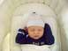 1997 Ford Probe - Baby sleeping soundly in a crib, wearing a striped hat and a sleepsuit with text on the front.