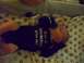 1997 Ford Probe - A baby lies on a patterned blanket in a crib, wearing a onesie with text.