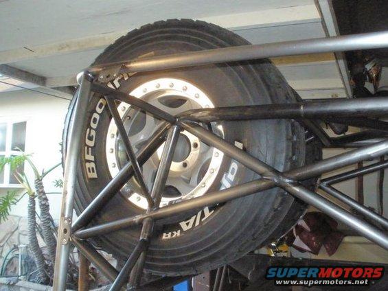 Spare tire mounted in a roll cage with BFGoodrich lettering