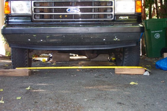 Rear of a dark-colored Ford Bronco, possibly lifted
