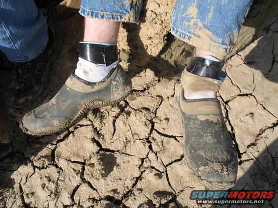 The rubber shoes I loaned my friend were rubbing holes in his ankles, so we made him some sock extensions out of shop rags and duck tape...