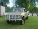 1975 International Scout II - This 1975 International Scout II pickup truck is parked on a grassy area next to a body of water.