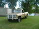 1975 International Scout II - This 1975 International Scout II pickup truck is parked on a grassy area next to a lake.