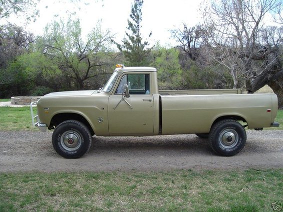 Tan pickup truck, side view. Appears to be an International pickup from the 1970s