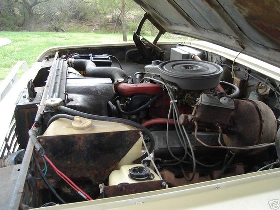 Engine bay with V8 engine, radiator, and air cleaner