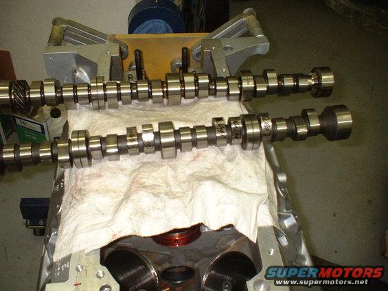 dscf0011.jpg Original cam (foreground) and the new cam in the background. Several lobes were damaged on original shaft.