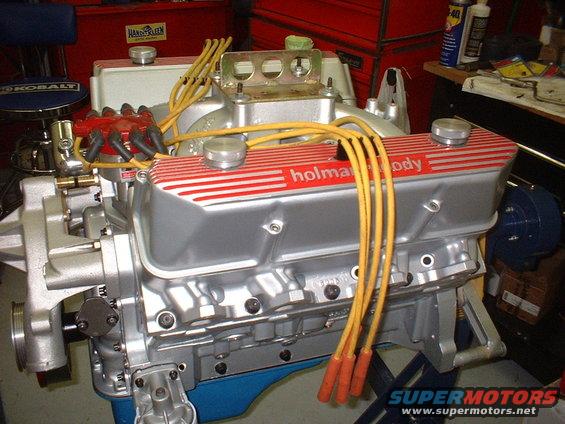 Engine with silver Holman Moody valve covers and yellow spark plug wires