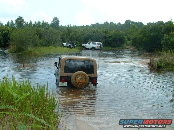 crossingwaterjeepstuck.jpg Alan at the Hummer Pit in his dad's heep, turning it into a submarine.