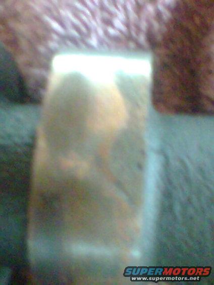 Close-up of a metallic part with some discoloration