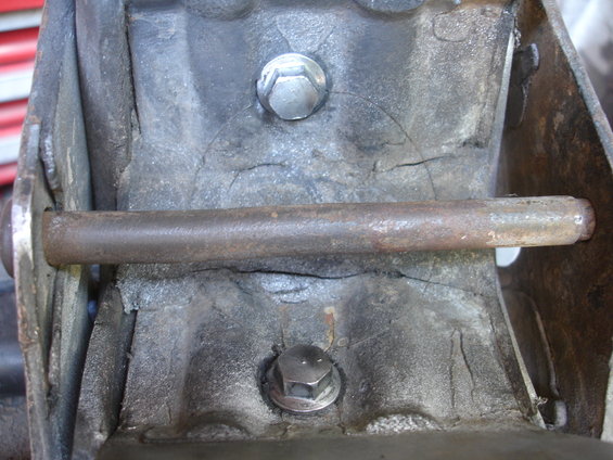 Cracked engine mount with bolt and metal rod