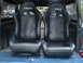 1979 Ford Bronco - Pair of Netami racing seats are shown in the cargo area of a vehicle.