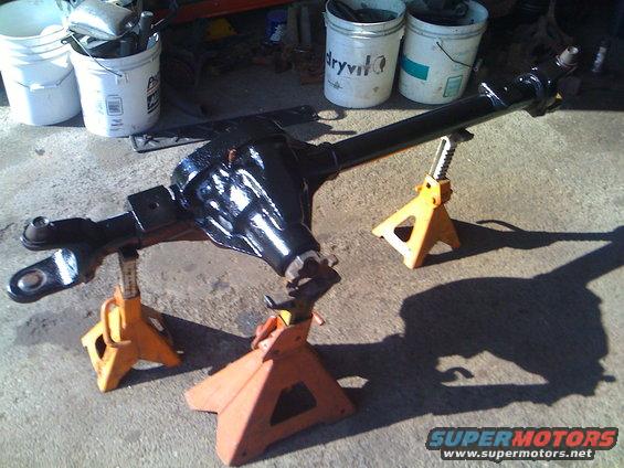 Black front axle assembly on jack stands