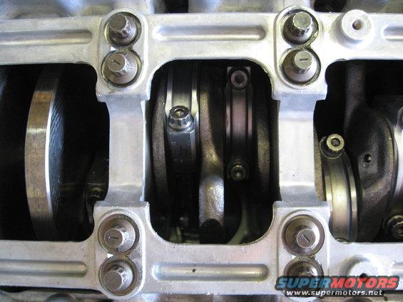 Close-up of engine crankshaft and connecting rods with bearing caps