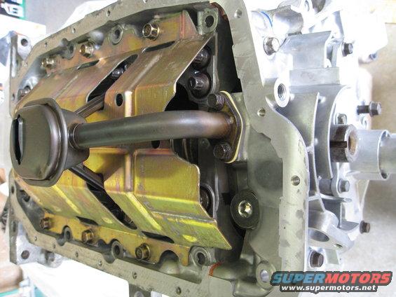 Engine oil pump assembly with pickup tube attached to the engine block
