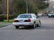 2003 Ford Crown Victoria - Rear view of a silver 2003 Ford Crown Victoria sedan on a residential street.