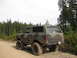 1979 Ford Bronco - This 1979 Ford Bronco, seen in a wooded area, features a camouflage paint scheme and lifted suspension.