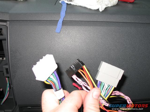 The connectors for the LockPick device.  The white plugs into the factory wire harness and the black goes into the LockPick device.