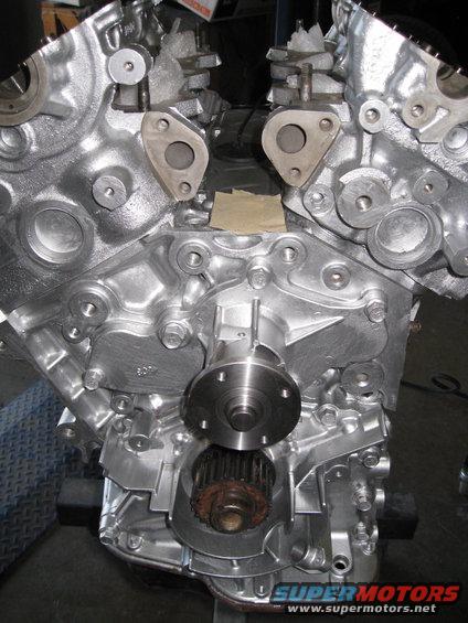 Engine block assembly showing water pump and timing gear