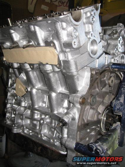 Silver painted engine block with masking tape on the intake manifold area