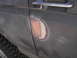 1987 Ford Bronco - Body filler is visible on the driver's side door of a 1987 Ford Bronco.