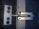 1988 Ford Bronco - Close-up of a metal door bolt latch mechanism.