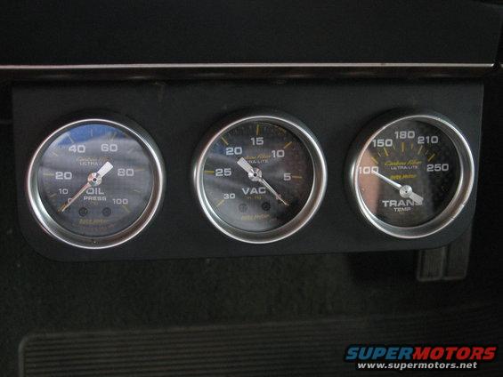 Three dashboard gauges: oil pressure, vacuum, and transmission temperature
