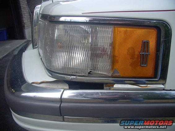 Then the only other fastener is the philips screw down the black strip at the rear, level with the Lincoln emblem.