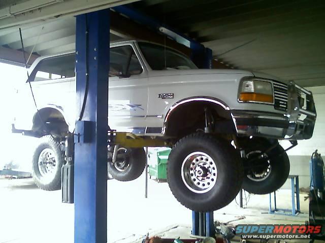 1996 Ford Bronco on a lift, front quarter view