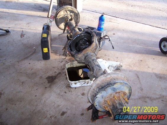Rear axle assembly removed from vehicle, showing differential and brake drum