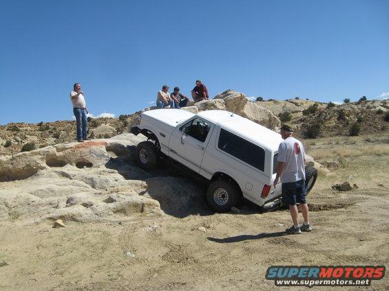 White 1993 Ford Bronco navigating rocky terrain