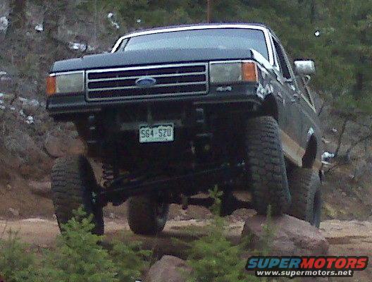 1990 Ford Bronco with lifted suspension on rocks